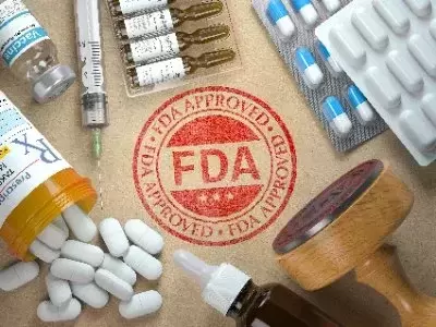 FDA STAMP SURROUNDED BY PILLS AND NEEDLES
