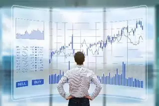 Man staring at large stock chart
