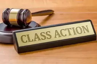 A gavel and a name plate with the engraving Class action